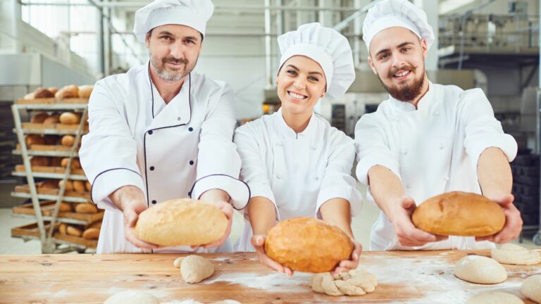 Participants making bread during a corporate baking event