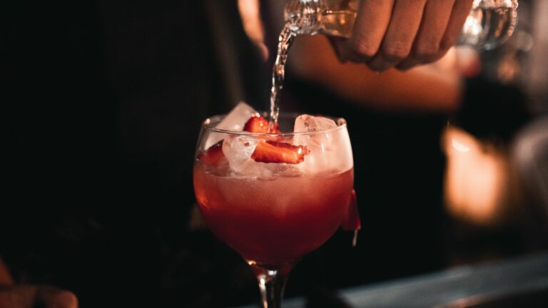 Glass of gin with strawberries at a gin-making event