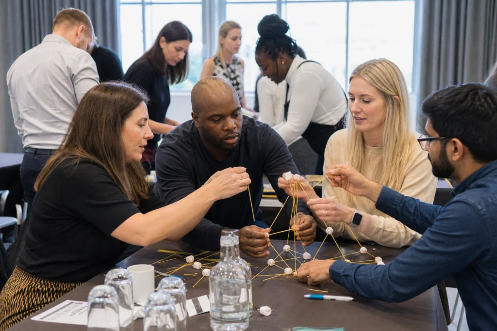Colleagues taking part in an indoor team building activity