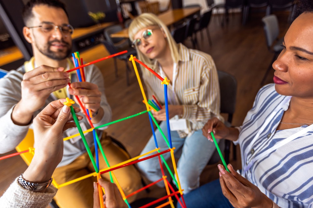 Team,Building,Activities,In,The,Office,With,Sticks concept,Of,Friendship,