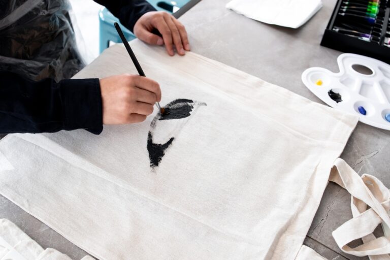Person,Painting,Design,On,Canvas,Bag,With,Black,Brush,Strokes