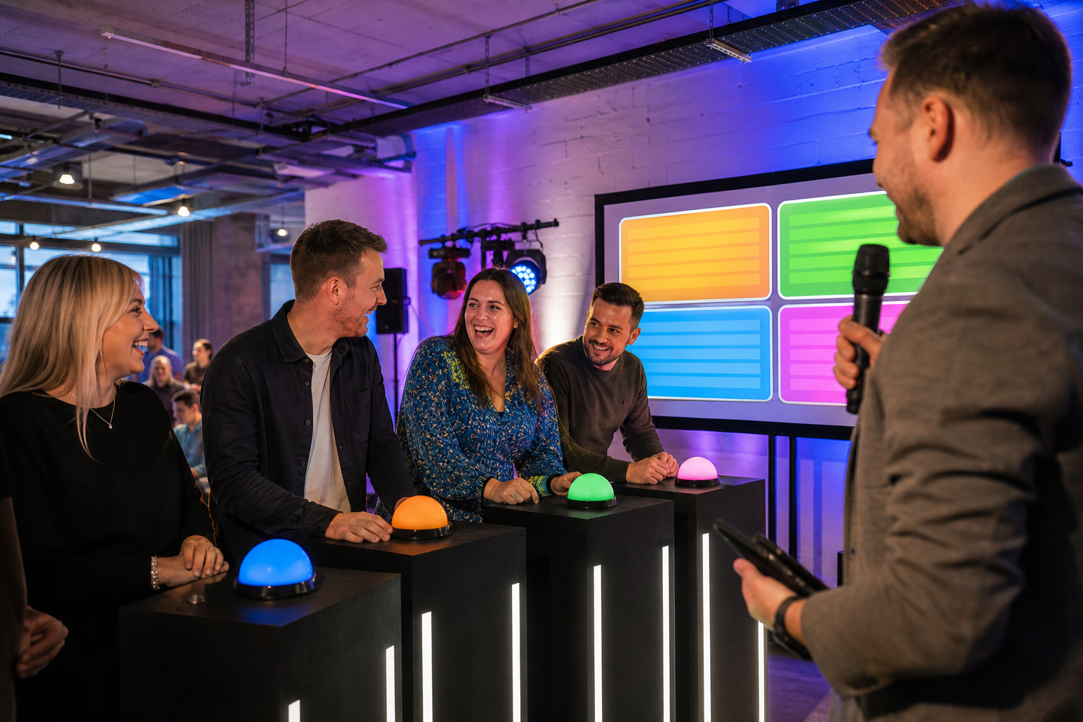 Office team taking part in an indoor game show style summer party event